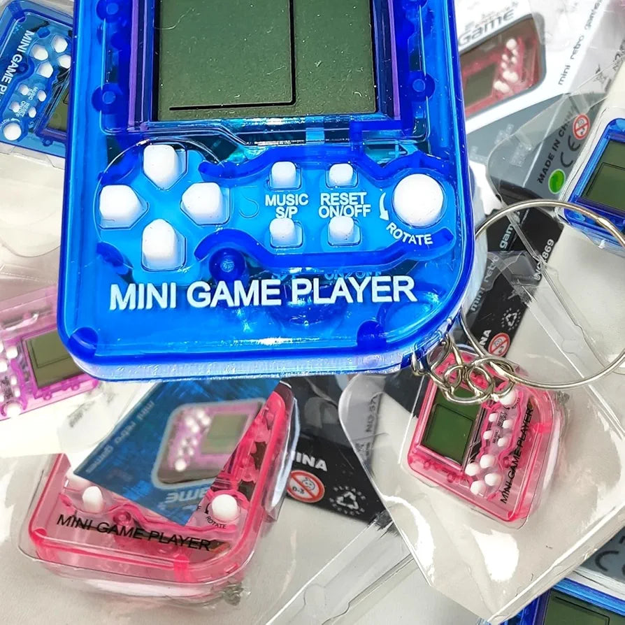 Mini Game Chaveiro Jogos Classicos Retro A Pilha Eletronico Crianças Presente Nostalgico Cores Rosa/Roxo